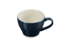 Blue mug with a beige interior on a white background