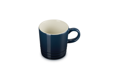Blue mug with a white interior on a white background