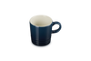 Blue mug with a white interior on a white background