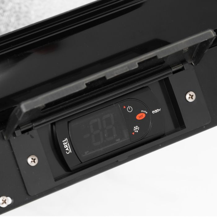 Digital temperature controller on a black appliance with visible brand name.